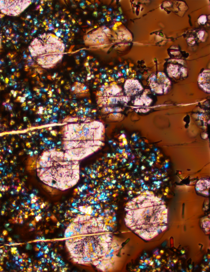Microscopic slide showing garnet and glass