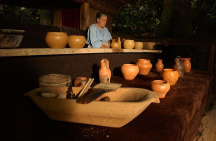 Click to view larger image A potter with traditional Cherokee pottery