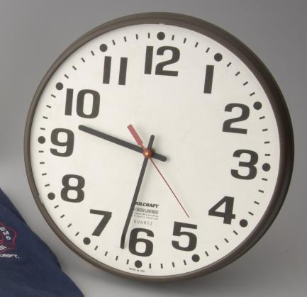 Office clock showing time of 9:32