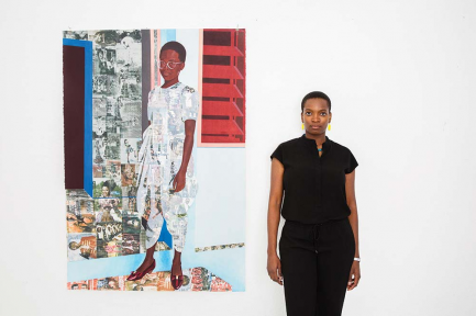 Artist posing with one of her paintings