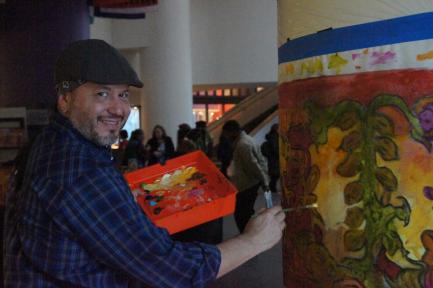 Man in exhibition of cacoa pods