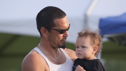 Man holds toddler