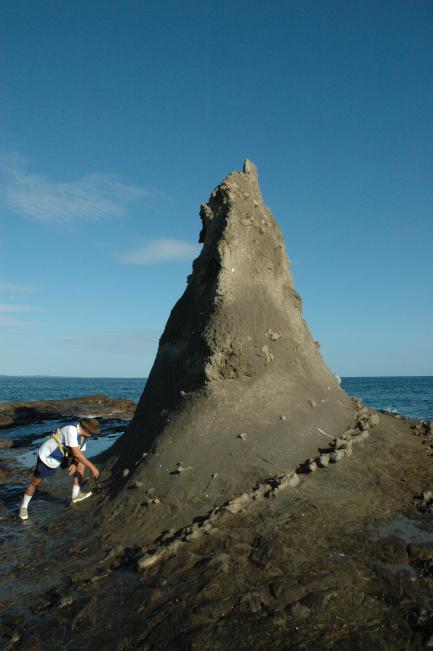 Man next to rock outcropping