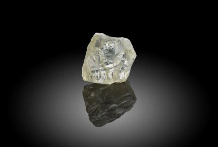 Uncut diamond on black background