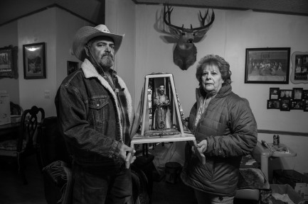 Frankie and Lopez holding religious icon