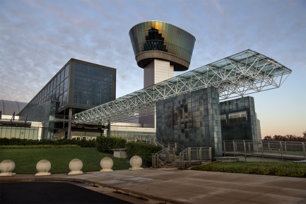 Outdoor view of front door with large overhang and air traffic tower
