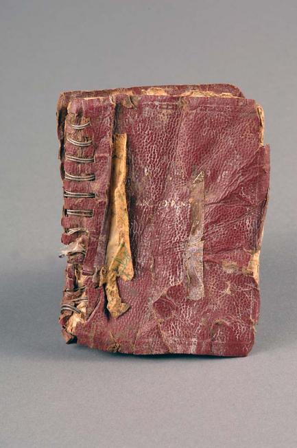 Battered notebook with reddish-brown cover