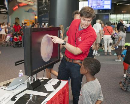Child at information table