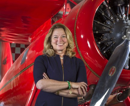Stofan in front of a red plane.