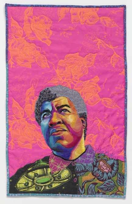 Bright pink quilt with womans face, eyes gazing upward.