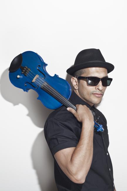 Quetzal Guerrero holding violin