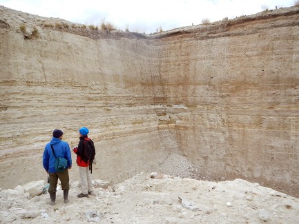 Two peole inside old quarry
