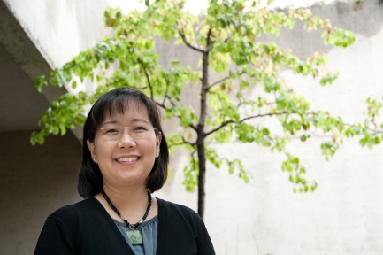 Portrait of Sasaki with green sapling in background