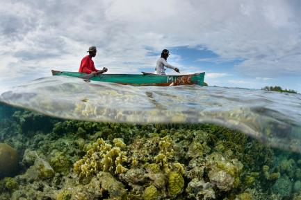 Two men in a bot seen from underwater