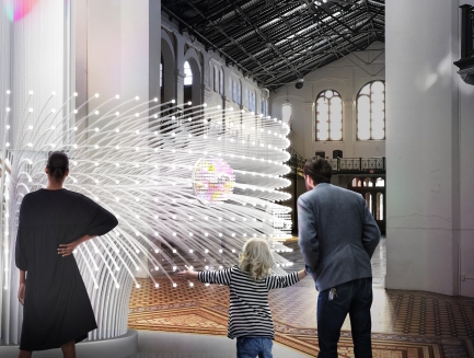 Group of people stand in front of interactive art installation