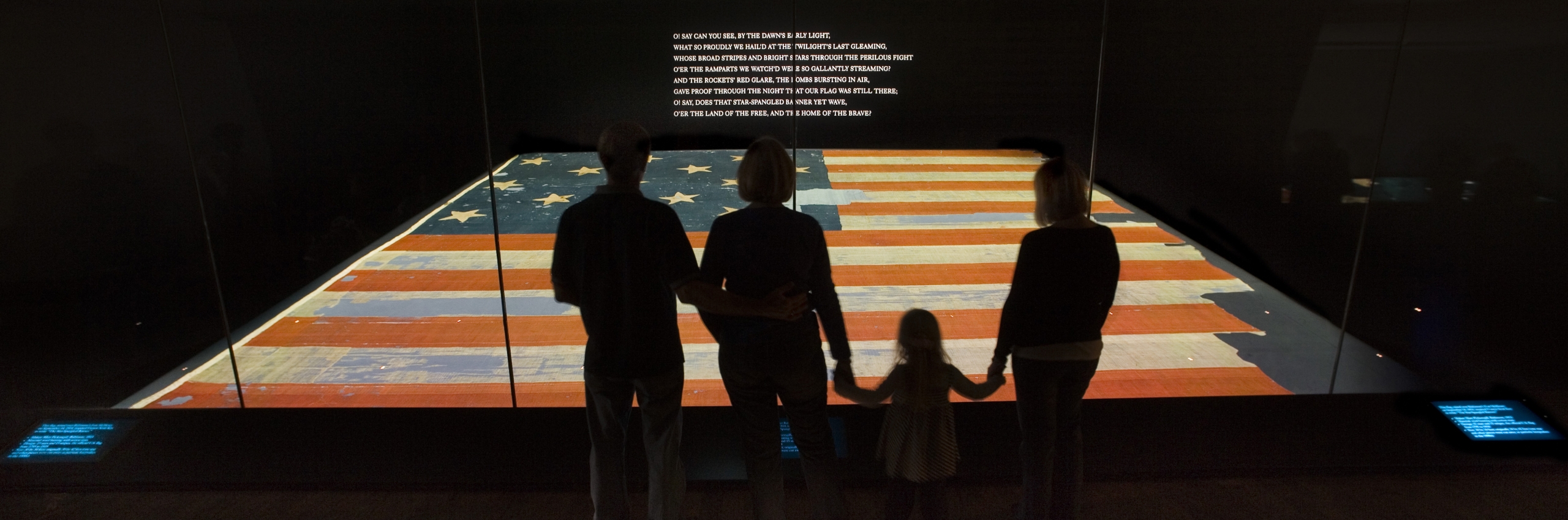 family viewing the Star-Spangled Banner.